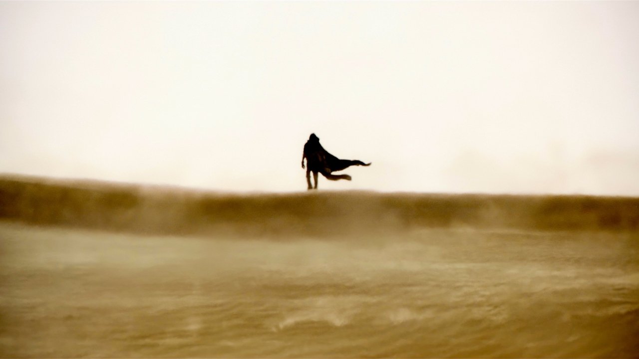 A figure walking across the desert in Dune: Part Two
